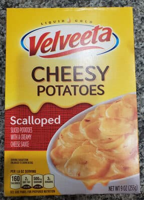 SCALLOPED SLICED CHEESY POTATOES WITH A CREAMY CHEESE SAUCE, SCALLOPED