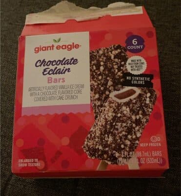 VANILLA ICE CREAM WITH A CHOCOLATE FLAVORED CORE COVERED WITH CAKE CRUNCH BARS, CHOCOLATE ECLAIRS