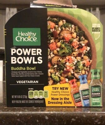 BUDDHA BOWL CHICKPEAS AND VEGETABLES SERVED ON TOP OF BARLEY, BROWN RICE, RED RICE AND RED QUINOA WITH A SESAME TAHINI SAUCE TOPPED WITH FETA CHEESE & SEEDS, BUDDHA BOWL