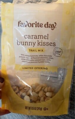 CARAMEL BUNNY KISSES TRAIL MIX A BLEND OF ROASTED PEANUTS, WHITE CHOCOLATE PRETZELS, CARAMEL-FLAVORED CHOCOLATE CHIPS, WHITE CHOCOLATE CARAMEL CUPS, WHITE CHOCOLATE PEANUTS & PRETZEL TWISTS, CARAMEL BUNNY KISSES