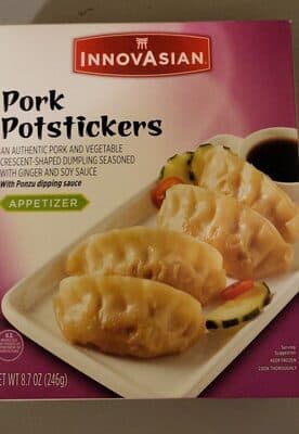 PORK POTSTICKERS AUTHENTIC PORK AND VEGETABLE CRESCENT-SHAPED DUMPLINGS SEASONED WITH GINGER, GARLIC AND SOY SAUCE APPETIZER, PORK POTSTICKERS