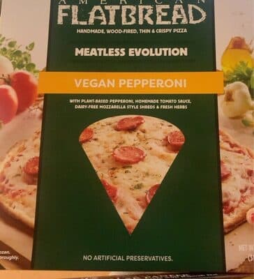 MEATLESS EVOLUTION VEGAN PEPPERONI WITH PLANT-BASED PEPPERONI, HOMEMADE TOMATO SAUCE, DAIRY-FREE MOZZARELLA STYLE SHREDS & FRESH HERBS HANDMADE, WOOD-FIRED, THIN & CRISPY PIZZA, MEATLESS EVOLUTION
